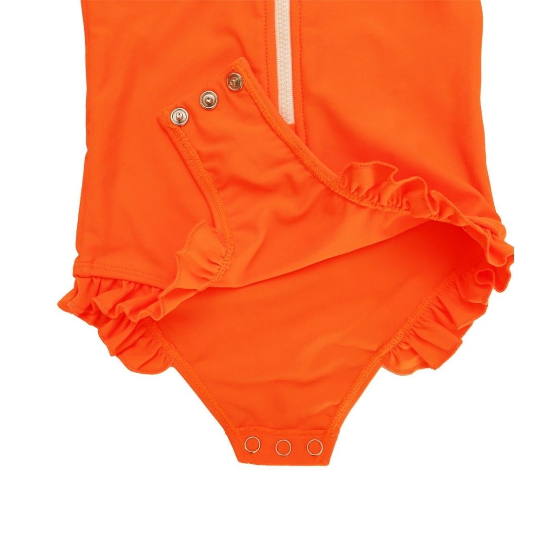 Close-up of a Vizzies Swim girls one-piece frill swimsuit in bright orange, showing the crotch snaps and ruffle details. 