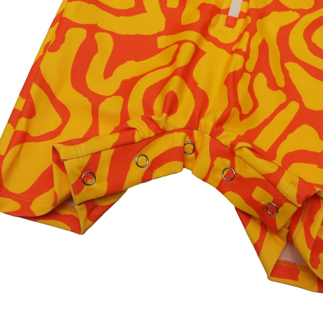 Bright sunburst print long-sleeve baby swimsuit from Vizzies Swim with a zipper front and crotch snaps, laid flat on a white background.