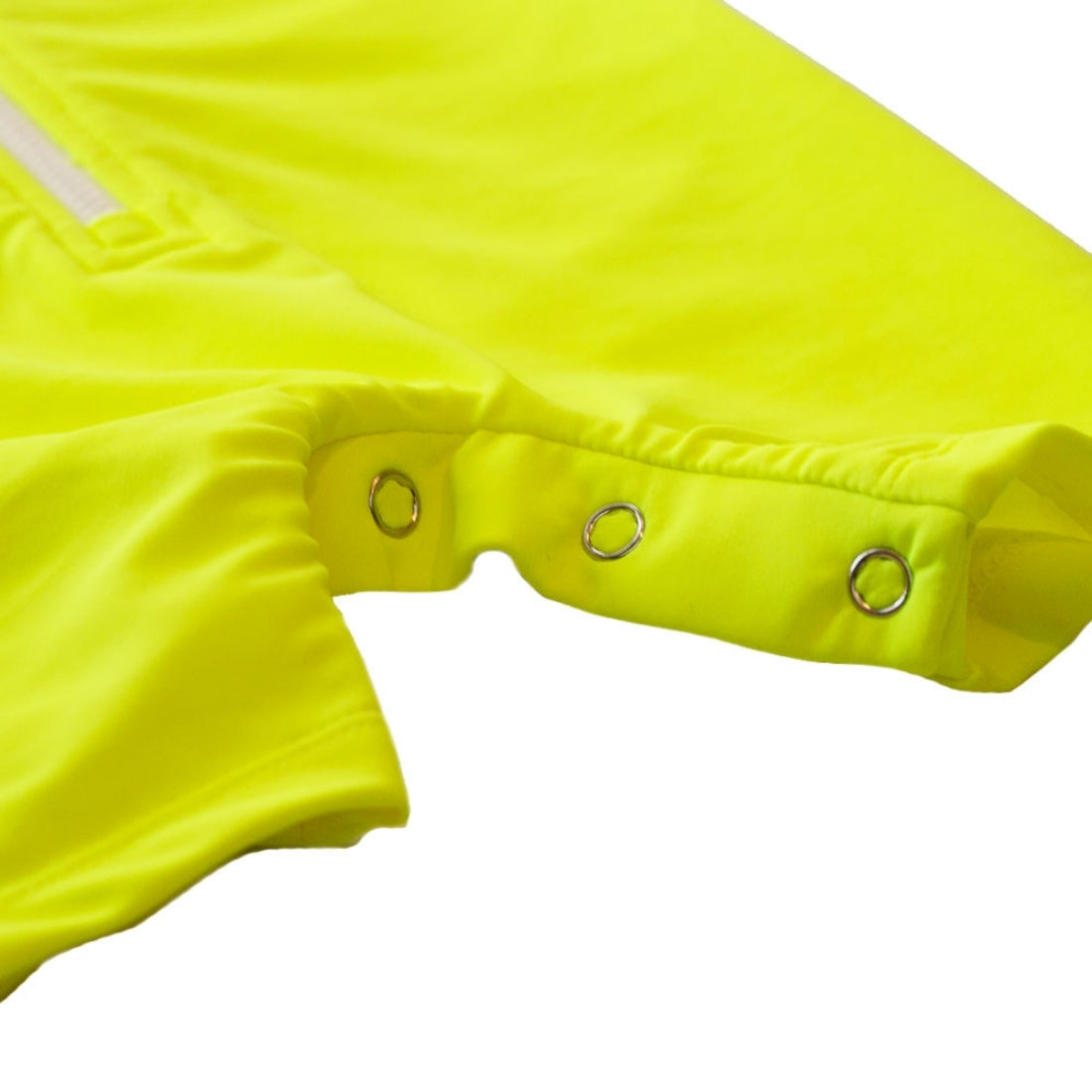 Close-up detail of a neon yellow baby swimsuit from Vizzies Swim, showing the crotch with three metal grommets and a light-colored zipper tab on a white background.