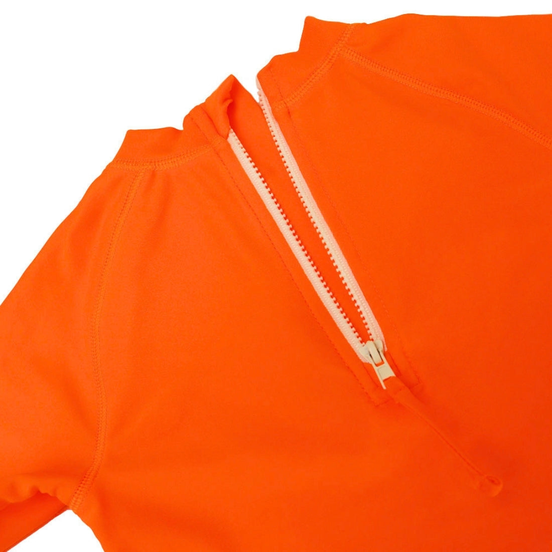 Close-up of a bright orange kids swim rashie with a white zipper running vertically down the centre.
